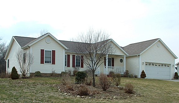 Split bedrooms. Separate dinette and formal dining rooms. Large cathedral ceiling in great room. 1st floor laundry. Large covered porch. 2-car garage