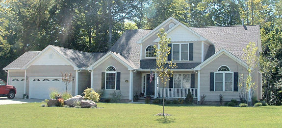 Large 1st floor master suite with cathedral ceiling and optional fireplace. 2 story foyer and great room. Loft overlooking foyer and great room. Large kitchen with breakfast bar and walk-in pantry. Boxed ceiling in living room/den and cathedral ceiling in dining room. Covered front and rear porches. Side entry 3-car garage.