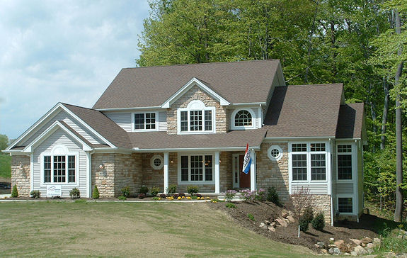 Large great room with cathedral ceiling and 3-sided fireplace. 2-story foyer and dinette. Sunk-in 1st floor master with 9' trayed ceiling and optional fireplace. Vaulted 1st floor study/den with French doors and transoms. Loft overlooking foyer. Tray ceiling in formal dining room. Large covered front porch. 1st floor laundry. 2-car side-entry garage.