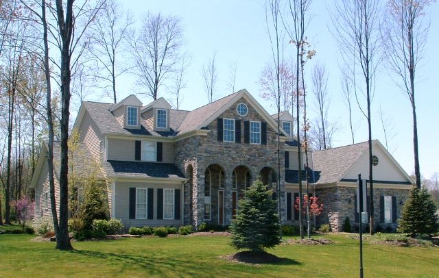 Large 1st floor master suite with sitting area. Large closets and optional fireplace. 13' ceiling in foyer. 2 story great room with bridge/loft above. 3rd floor loft overlooks great room and foyer. Tray ceilings in parlor and formal dining rooms. Large kitchen/dinette with walk-in pantry. Large covered front porch. Side entry 3-car garage with storage area. (Optional bonus room / 5th bedroom adds 294 sq. ft.)