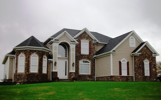 1st floor master suite with vaulted ceilings, 2 walk-in closets, and glamour bath. 1st floor den/guest bedroom with 10'+ ceilings. Bridge overlooks 2-story foyer and great room with wall of windows and loft above. Formal dining room with bay and tray ceiling. Large kitchen with corner window sink, huge breakfast bar, and walk-in pantry. Cathedral ceiling in the morning room with windows all around. 1st floor laundry. Covered arched entry. 2-car side-entry garage.